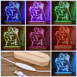 Grid showing etched photo lamp glowing in sixteen different colours with a remote control