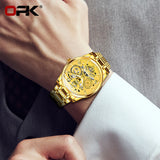 Gold OPK skeleton watch worn on a wrist with a white shirt cuff