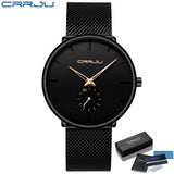 Black mesh band watch with black dial and teal accented hands