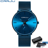 Blue mesh band watch with blue dial and silver hands