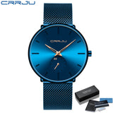 Blue mesh band watch with deep blue gradient dial and silver hands