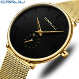 Gold mesh band watch with black dial and gold subdial hands