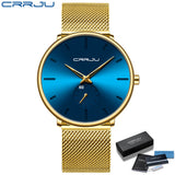 Gold mesh band watch with blue dial and silver hands