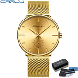 Gold mesh band watch with gold sunburst textured dial