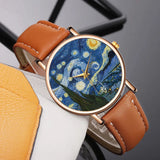 Rose gold watch with swirling blue Starry Night artwork dial and tan brown leather strap