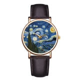 Rose gold art watch with blue swirling night sky dial and dark leather strap