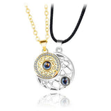 Gold sun pendant necklace with projection stone and black cord