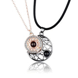 Rose gold moon pendant necklace with projection stone and black cord