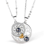 Silver sun and moon pendant necklaces joined together by magnetic closure