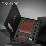 TOMI gift box containing brown leather wallet, pen and watch with tan strap