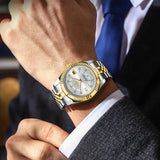 Two-tone silver and gold watch with blue dial and fluted bezel