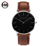 Rose gold case black dial watch with black leather strap