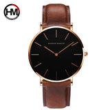 Rose gold case black dial watch with brown leather strap