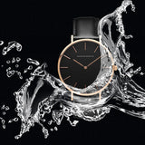 Black dial watch shown with a water splash graphic highlighting water resistance