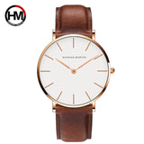 Rose gold case white dial watch with brown leather strap