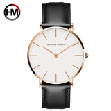 Rose gold case white dial watch with black leather strap