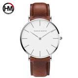 Silver case white dial watch with brown leather strap on white background