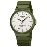 Green case watch with black dial shown on a dark background