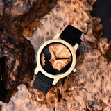 Dark wooden watch case shown resting on natural tree bark