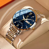 Silver watch with blue sunray dial, gold hands and steel link bracelet