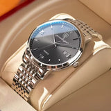 Silver watch with green sunray dial and stainless steel bracelet on white