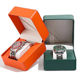 Orange and green PU leather watch cases both open each displaying a watch
