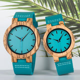 Matching large and small bamboo watches with turquoise dials and teal leather straps