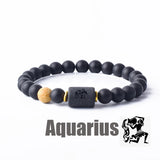 Dark stone bead bracelet with Aquarius zodiac symbol charm