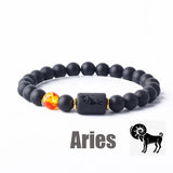 Dark stone bead bracelet with Aries zodiac symbol charm