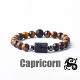 Tiger eye bead bracelet with Capricorn zodiac symbol bar charm