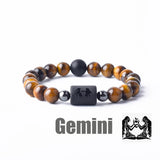 Tiger eye bead bracelet with Gemini zodiac symbol bar charm