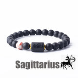 Dark stone bead bracelet with Sagittarius zodiac symbol charm