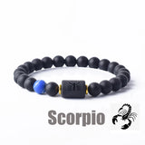 Dark stone bead bracelet with Scorpio zodiac symbol charm