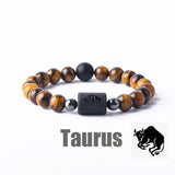 Tiger eye bead bracelet with Taurus zodiac symbol bar charm