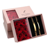 Gold couple bracelet set displayed in a pink gift box with red roses and lid