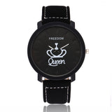Black leather strap watch with black King crown design dial shown close up