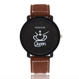 Brown leather strap watch with crown design dial on white background