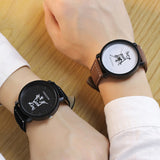 Two wrists together each wearing a King and Queen leather strap watch