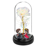 Blue galaxy rose in a lit glass dome with LED lights and white pebbles