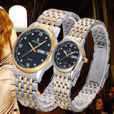 Two-tone silver and gold couple watches with black dial worn side by side