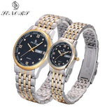 Two-tone silver and gold couple watches with black dial on white background